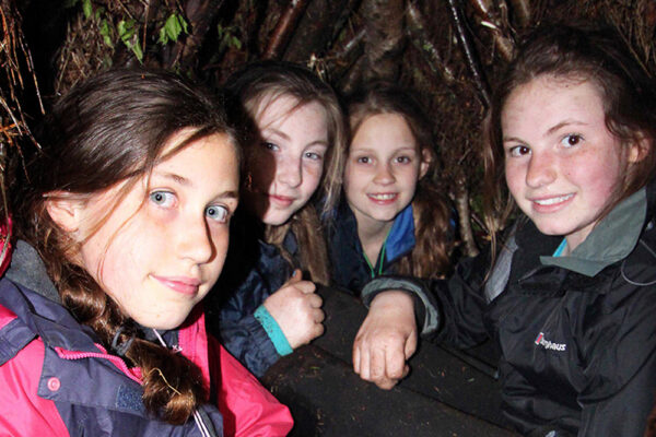 Girls in Woodland Shelter
