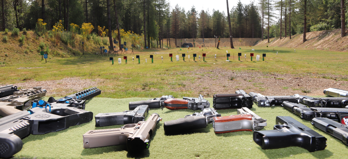 Weapons on Table with Range in Background
