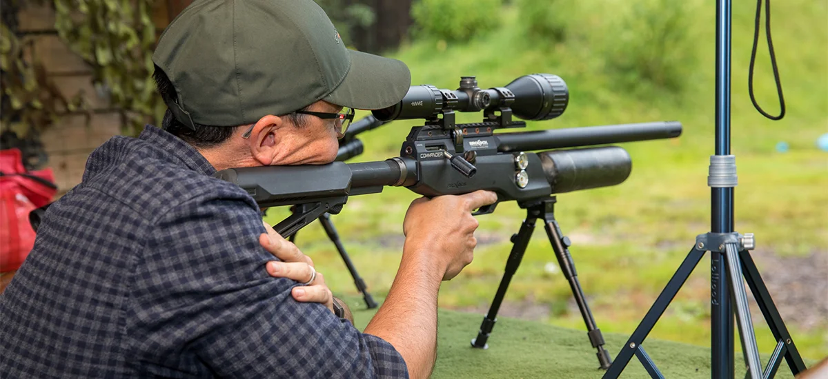 Man Aiming Rifle